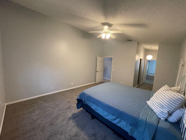 carpeted bedroom featuring ceiling fan, ensuite bath, and a textured ceiling