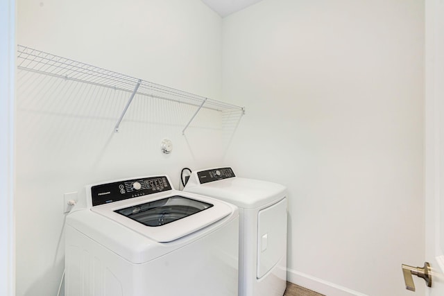 laundry room with washing machine and clothes dryer