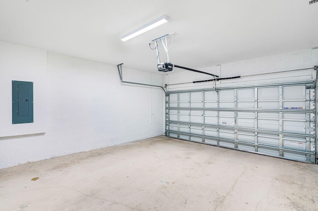 garage featuring electric panel and a garage door opener