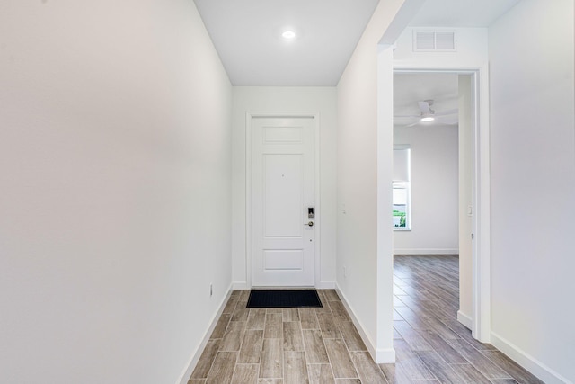 doorway to outside featuring ceiling fan