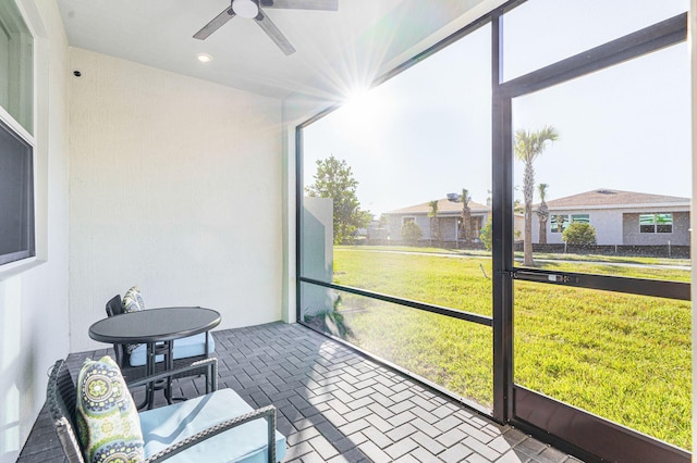 sunroom / solarium with ceiling fan