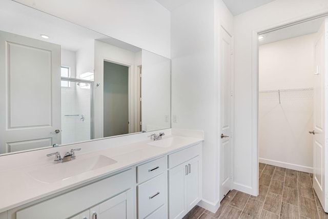 bathroom featuring vanity and walk in shower