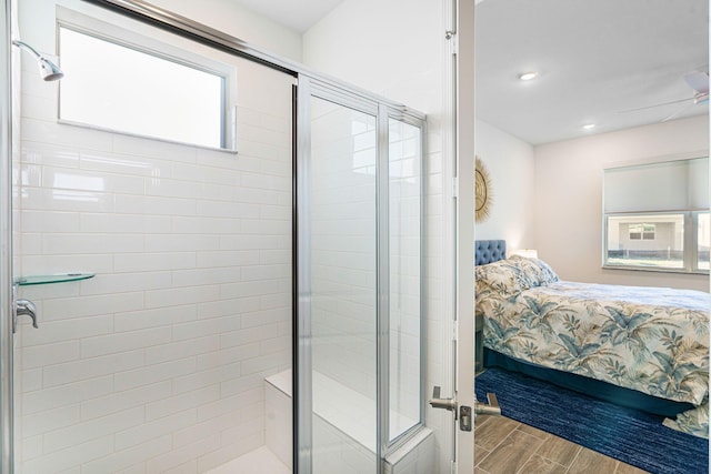 bathroom featuring a shower with door