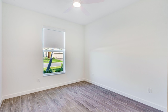 unfurnished room featuring ceiling fan and hardwood / wood-style flooring