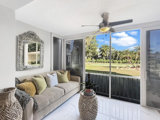 sunroom / solarium with ceiling fan