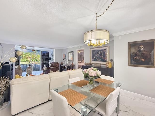 dining area featuring ceiling fan with notable chandelier, a textured ceiling, and crown molding