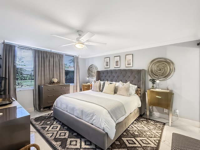 bedroom with ceiling fan and crown molding