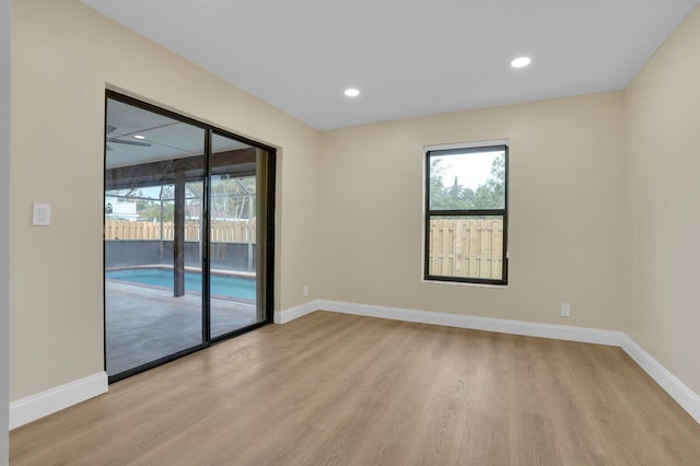 unfurnished room with light hardwood / wood-style flooring