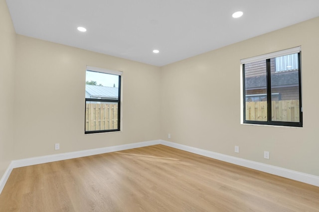 unfurnished room featuring light hardwood / wood-style floors