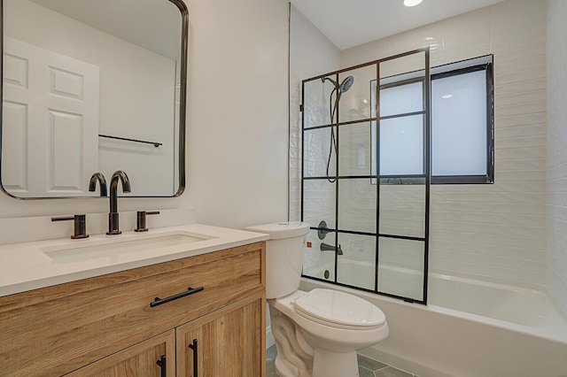 full bathroom featuring shower / bath combination with glass door, tile patterned floors, vanity, and toilet