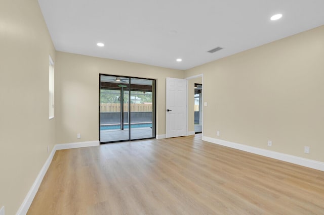 spare room with light hardwood / wood-style flooring