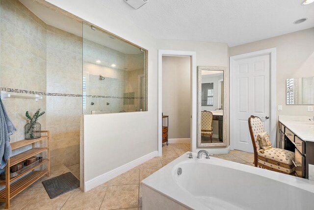 bedroom featuring ceiling fan, light hardwood / wood-style floors, and a textured ceiling