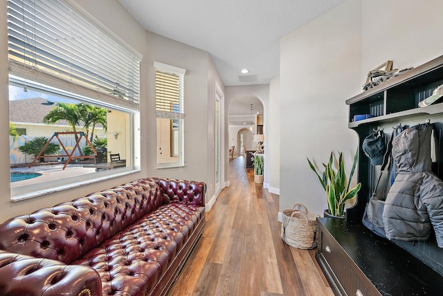 rec room featuring hardwood / wood-style flooring and ceiling fan