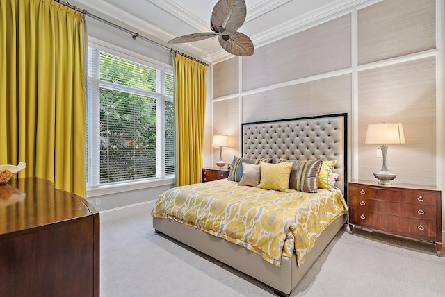 bedroom with ceiling fan, light colored carpet, multiple windows, and ornamental molding