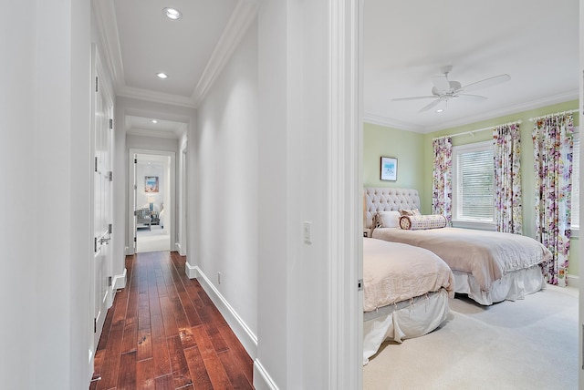 bedroom featuring ceiling fan, dark hardwood / wood-style floors, and crown molding