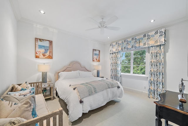 carpeted bedroom with ceiling fan and ornamental molding