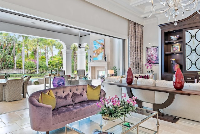 living room featuring a notable chandelier, a premium fireplace, beamed ceiling, coffered ceiling, and ornamental molding