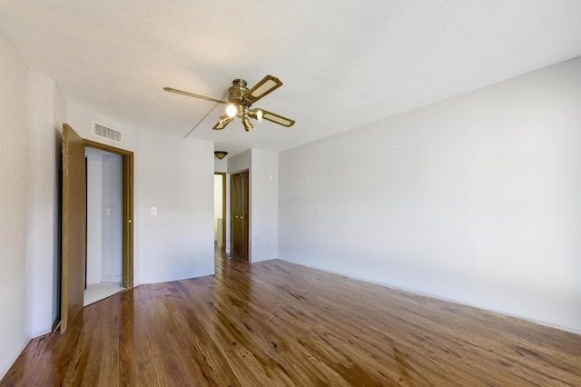 unfurnished room with hardwood / wood-style floors and ceiling fan