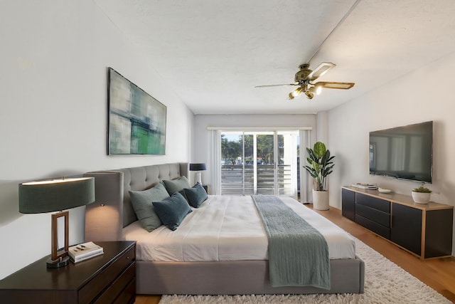 bedroom featuring wood-type flooring and ceiling fan