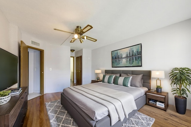 bedroom featuring light wood-type flooring and ceiling fan