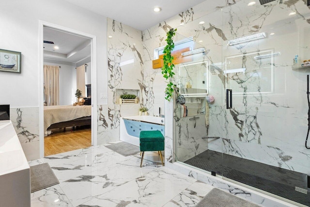 bathroom with hardwood / wood-style flooring and an enclosed shower