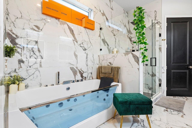 bathroom featuring a shower with shower door and tile walls