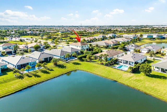 birds eye view of property featuring a water view