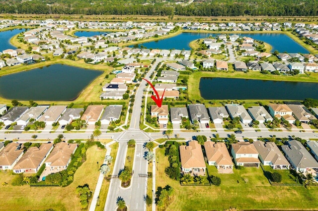 drone / aerial view with a water view