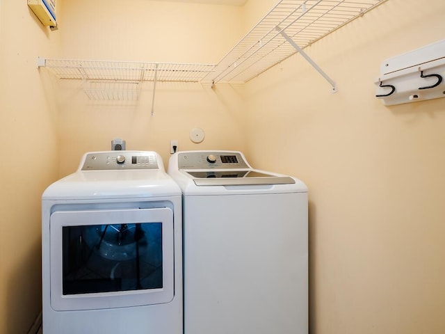 laundry room with independent washer and dryer