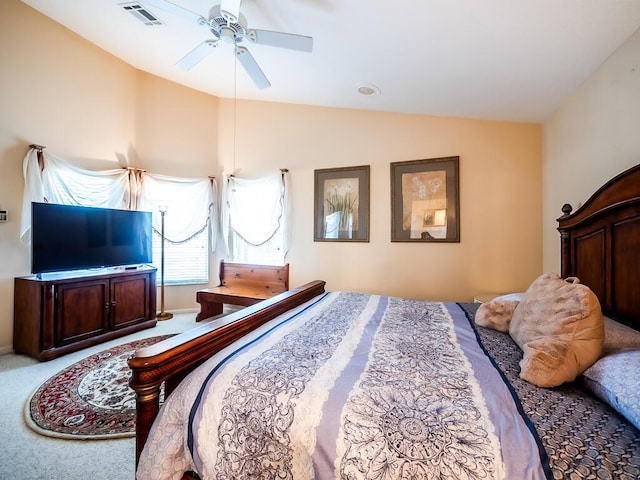 carpeted bedroom with vaulted ceiling and ceiling fan