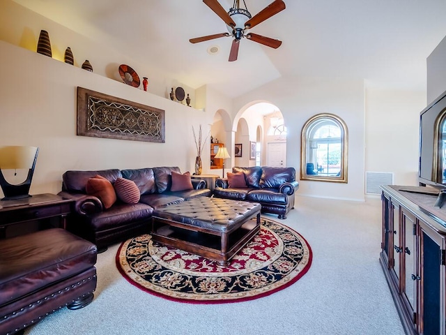 living room with ceiling fan and carpet