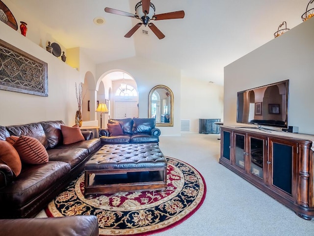 living room featuring light carpet, ceiling fan, and lofted ceiling