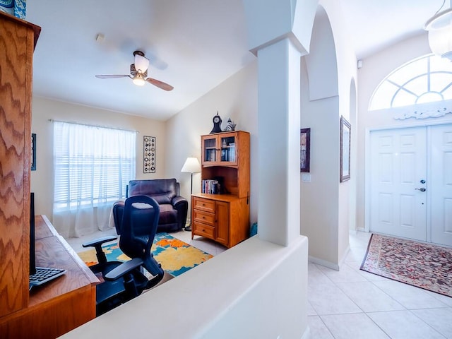 tiled office featuring high vaulted ceiling, ceiling fan, and a healthy amount of sunlight