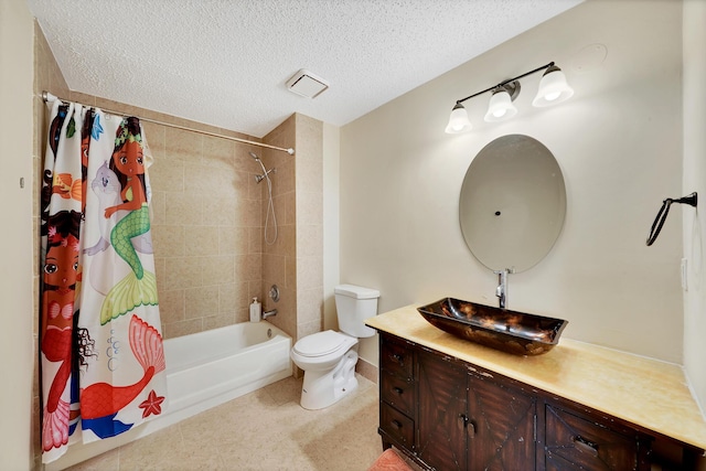 full bathroom featuring vanity, tile patterned flooring, toilet, a textured ceiling, and shower / tub combo