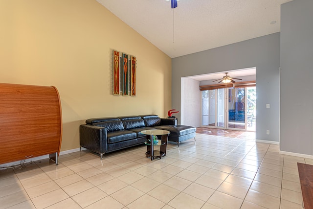 living room featuring high vaulted ceiling, ceiling fan, and light tile patterned flooring