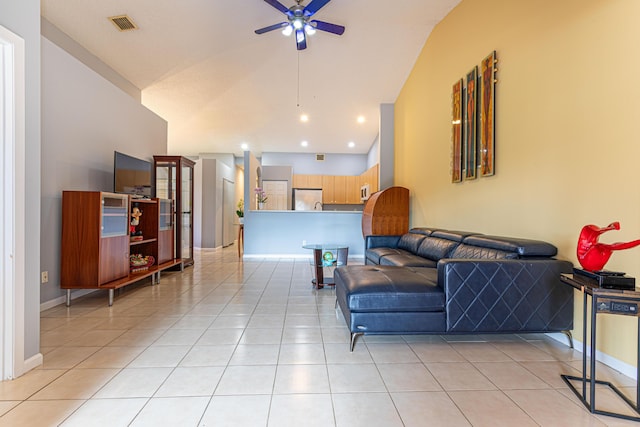 living room with light tile patterned floors, vaulted ceiling, and ceiling fan