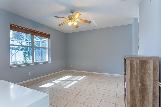 interior space featuring a textured ceiling and ceiling fan