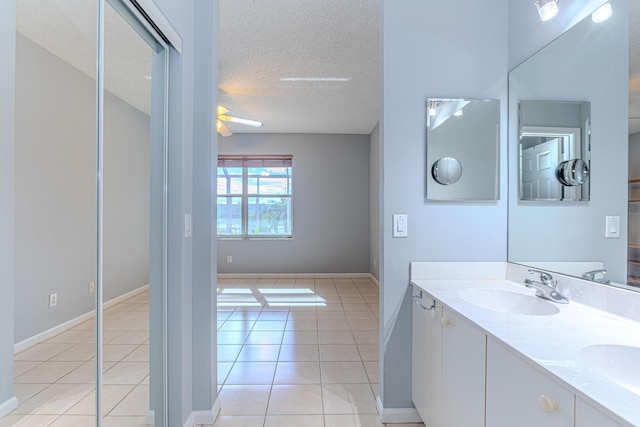 bathroom with vanity, a textured ceiling, tile patterned floors, and ceiling fan