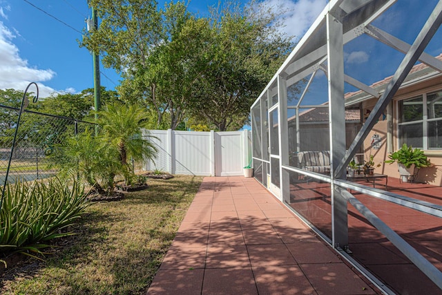 view of yard with a lanai and a patio