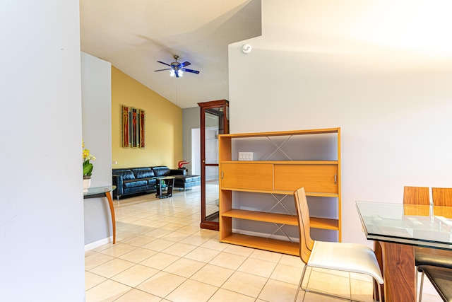 interior space featuring ceiling fan and lofted ceiling