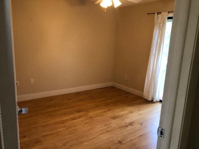 empty room with light wood-type flooring and ceiling fan