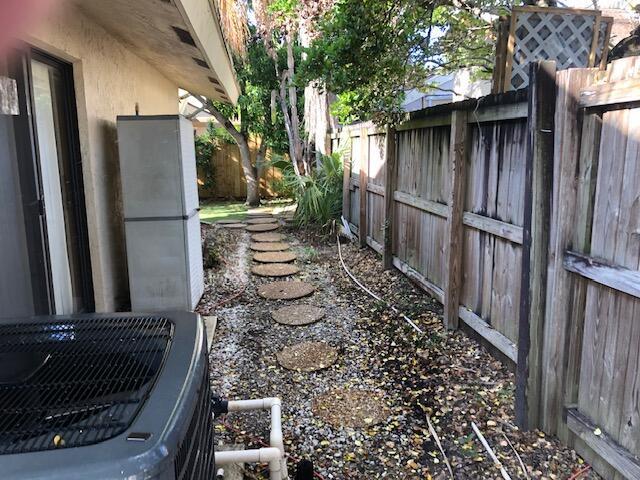 view of yard featuring central air condition unit