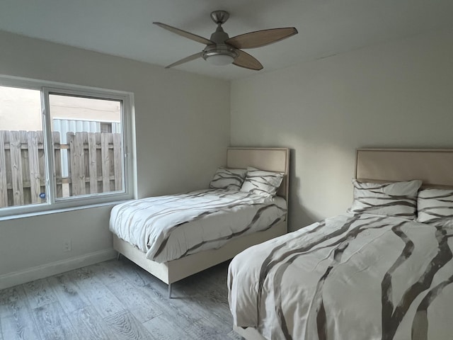 bedroom featuring hardwood / wood-style floors and ceiling fan