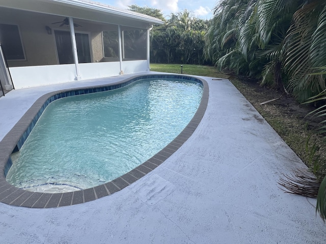 view of pool with a sunroom