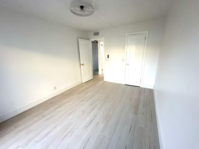 unfurnished bedroom featuring light hardwood / wood-style floors