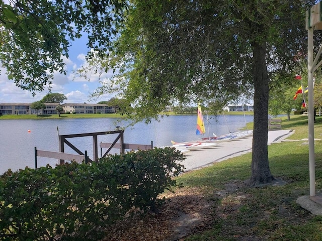 property view of water with a dock