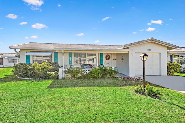 ranch-style house with a front yard and a garage