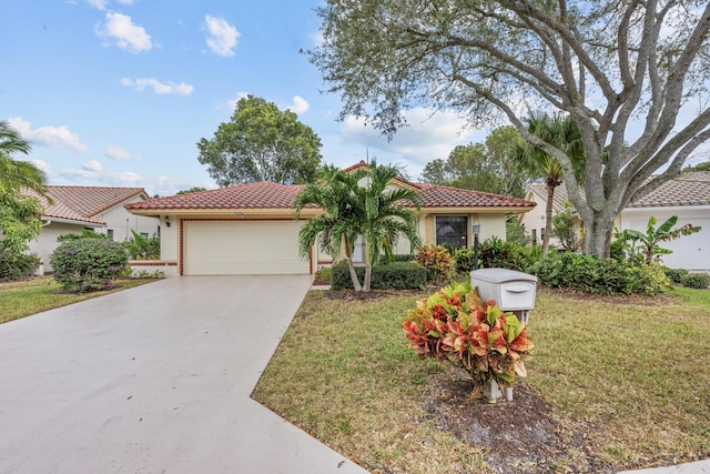 mediterranean / spanish home featuring a garage and a front lawn