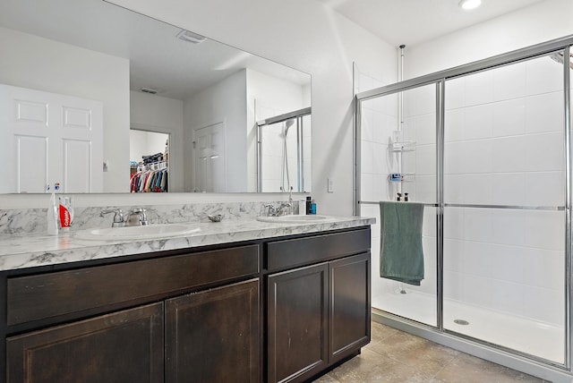 bathroom with vanity and walk in shower