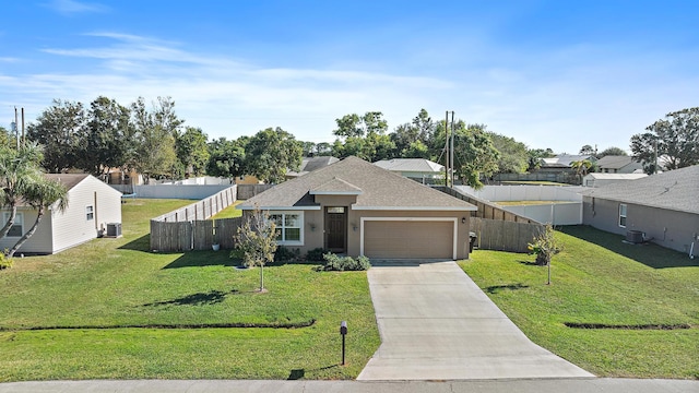 view of front facade featuring central AC unit, a garage, and a front yard